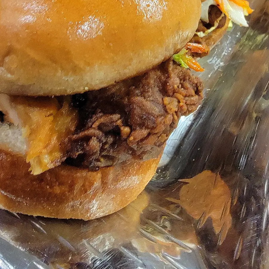 Fried chicken sliders lined up on trays for service — Bay Area catering by chef Coach Cal